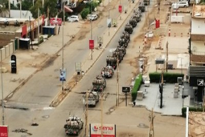 RSF vehicles patrol the empty streets of Khartoum.