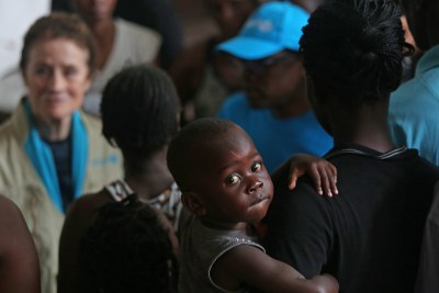 UNICEF Executive Director Henrietta H. Fore speaks with internally displaced people as she visits a secondary school used to shelter evacuees from Cyclone Idai (file photo).