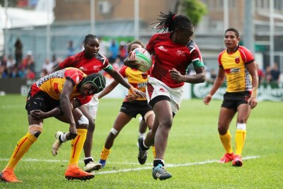 Kenya's Sheilla Chajira cuts through the Papua New Guinea defence on day one of the World Rugby Women's Sevens Series Qualifier in Hong Kong on April 4, 2019.