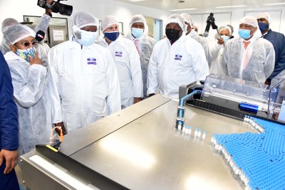 South African President Cyril Ramaphosa (in black face mask) and other leaders visit Aspen Pharmacare manufacturing facility in Gqeberha on March 29, 2021. The visit focused on progress in vaccine production as part of the partnership between government and the private sector in the national Coivd-19 vaccination programme.